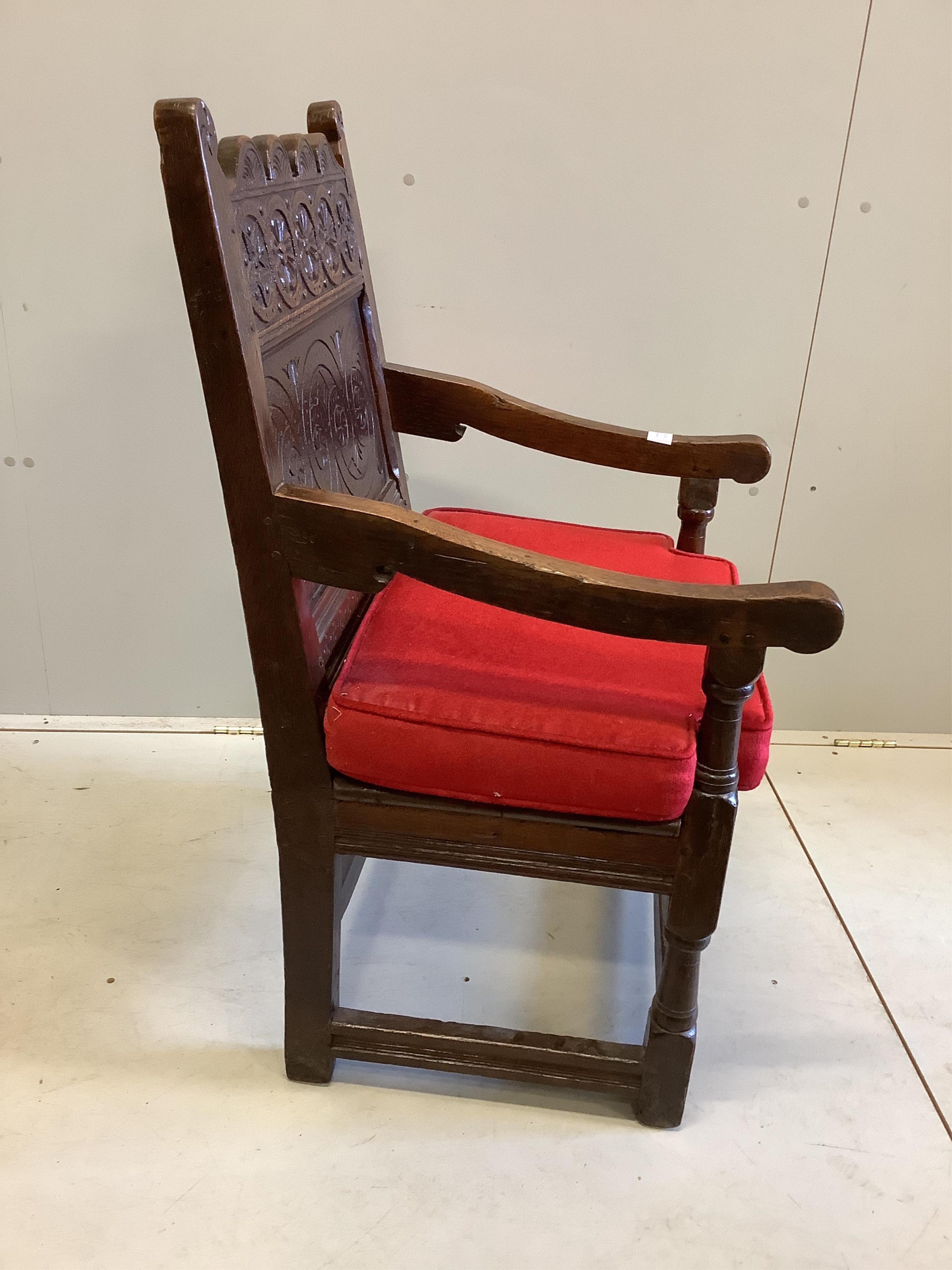 A 17th century carved oak wainscot elbow chair, width 57cm, depth 56cm, height 98cm. Condition - good